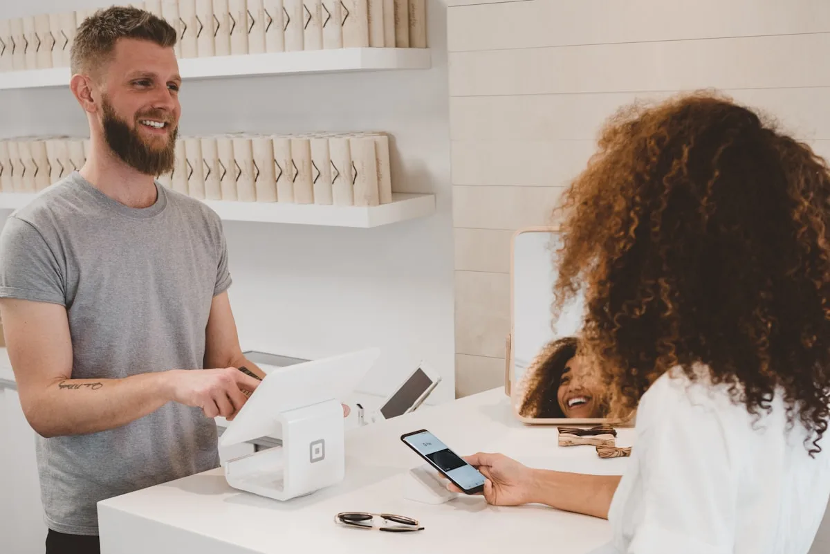 Patient reviewing a medical bill and payment options at a clinic front desk